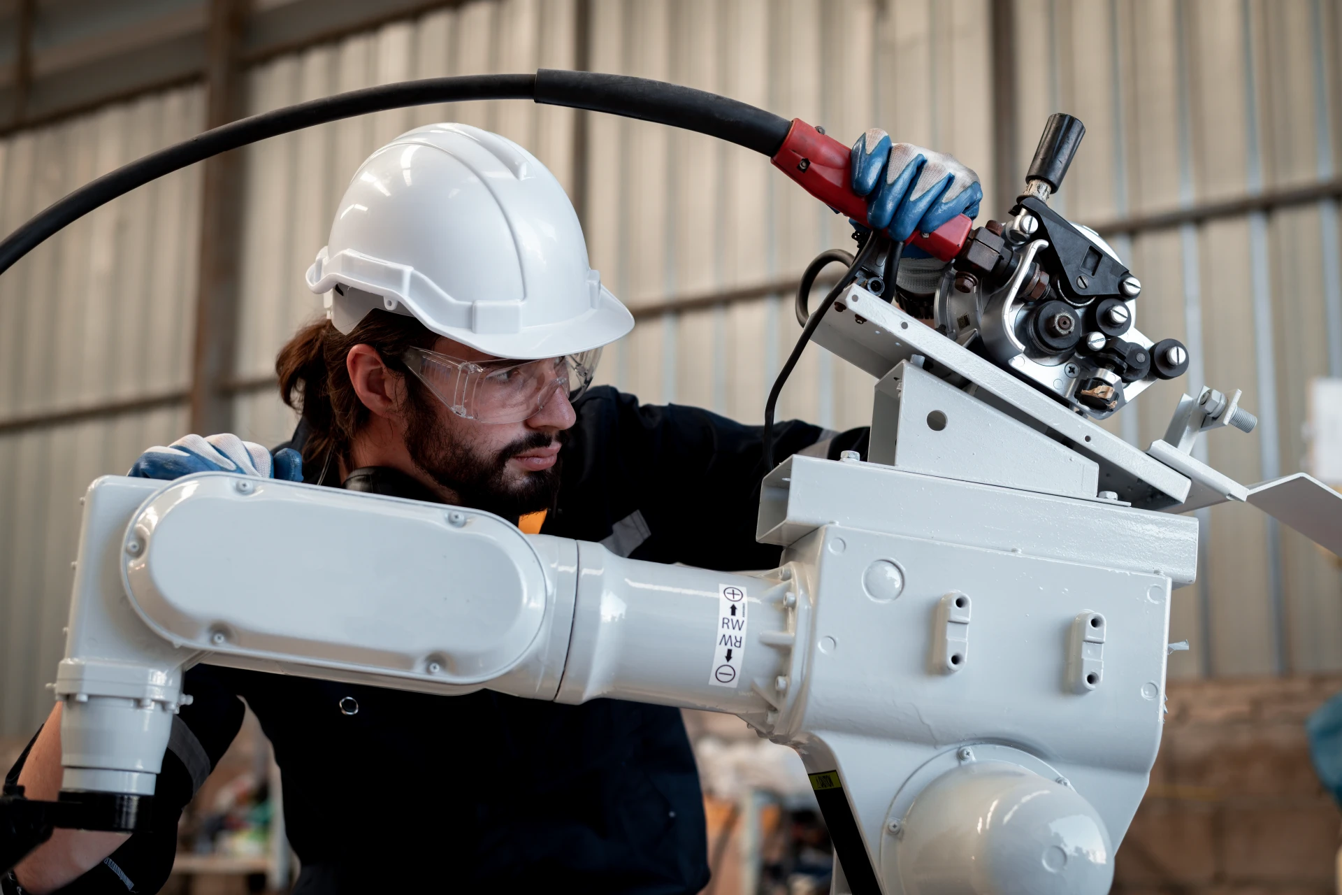 img_engineer-factory-industry-wearing-safety-uniform-work-checking-system-welding-robots-welding-steel-electrical-by-control-system-robot-automate-industry-manufacture-concept